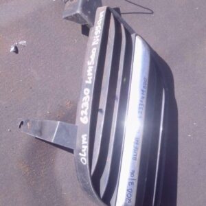 Left side front spotlight cover for 2006 Nissan Almera shown from an angled top view, used condition.Left side