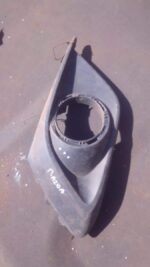 Right side spotlight cover for Mazda 3, angled view, used condition visible on surface.Right side spotlight co