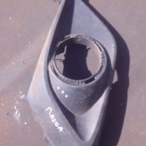 Right side spotlight cover for Mazda 3, angled view, used condition visible on surface.Right side spotlight co