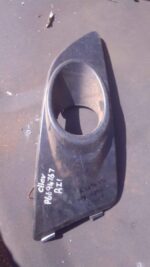 Right headlight spotlight cover for 2013 Chevrolet Aveo shown from front angle, used condition.Right headlight