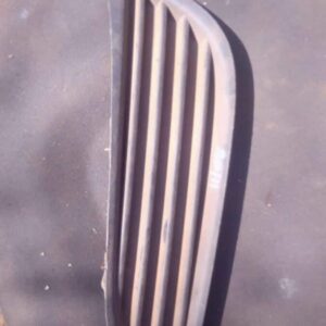 Right-side headlight spotlight cover for Opel Astra, viewed front-on, used condition.Right-side headlight spot