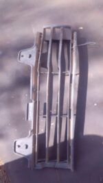 Left spotlight cover for a 2008 Toyota Landcruiser, used, shown from the front angle.Left spotlight cover for