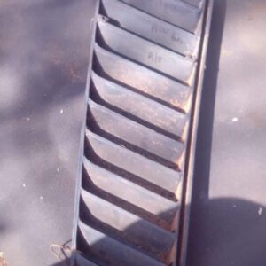 Right side air vent for a 1978 Volkswagen Microbus shown from front angle, used condition.Right side air vent