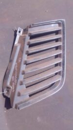 Left side spotlight cover for Mitsubishi L200, used condition, shown against a plain background from the front