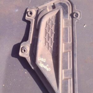 Left front car headlight cover angled slightly from above, showing used condition with minor wear.Left front c