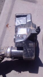 Used air filter housing for Nissan Tiida, shown from a top angle displaying connection points and seals.Used a