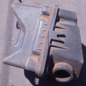 Used air filter housing for Chevrolet Aveo, shown from top angle displaying intake and mounting points.Used ai