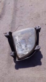 Right headlight spotlight assembly for Kia Sportage, used, shown from front angle.Right headlight spotlight as