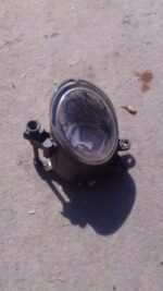 Front view of a used Audi A4 B7 headlight assembly with clear lens and chrome housing.Front view of a used Aud