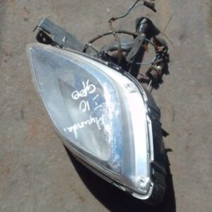 Right side spotlight for Hyundai Elantra shown from angled front view, used condition.Right side spotlight for