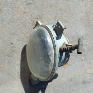 Left-side headlight assembly for Volvo S60, angled view, used condition.Left-side headlight assembly for Volvo