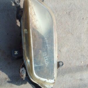 Left-sided headlight assembly for Hyundai H1, used condition, shown from front-left angle.Left-sided headlight