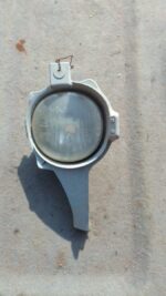 Right side spotlight for 2013 Toyota Hilux, used condition, shown angled slightly from front view.Right side s