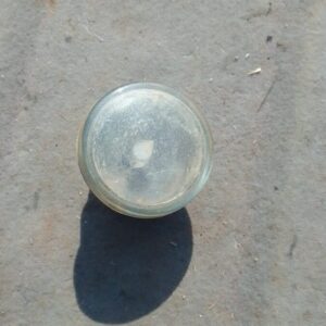 Left front spotlight for Citroen C3, angled view, used condition, showing lens and mounting bracket.Left front