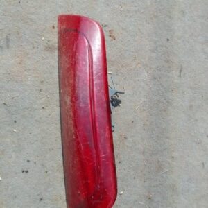 Rear brake light assembly for Nissan Micra 3rd gen, shown from the back, used condition.Rear brake light assem
