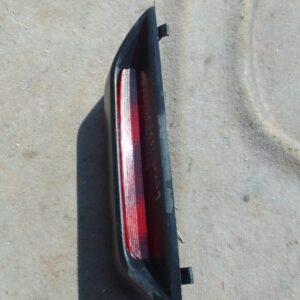 Rear view of a used 3rd brake light for Lexus IS 200, showing the lens and mounting points.Rear view of a used