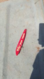 Left rear reflector for Hyundai Elantra, shown from side angle, used condition.Left rear reflector for Hyundai