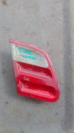 Left inner taillight for Mercedes W210 shown front angled view, used condition.Left inner taillight for Merced