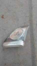 Right inner taillight of a 2011 Toyota Corolla displayed head-on, used condition visible.Right inner taillight