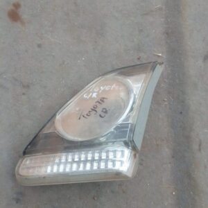 Right inner taillight of a 2011 Toyota Corolla displayed head-on, used condition visible.Right inner taillight