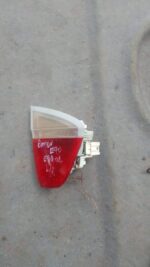 Left inner taillight for BMW E90, angled front view, used condition, showing lens and mounting points.Left inn