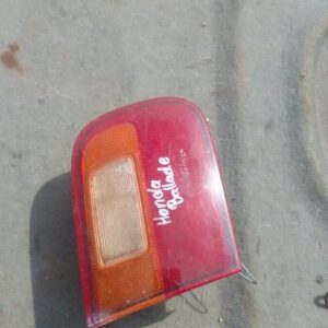 Right inner taillight for 1995 Honda Ballade, used, shown from rear angle on white background.Right inner tail