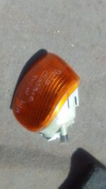 Left corner light for Volkswagen Polo Classic, used, shown from front angle on white background.Left corner li