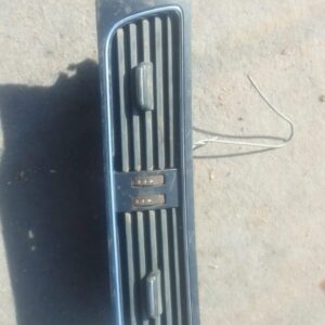 Front view of a used Audi A4 B8 centre dash air vent showing vent slats and mounting frame.Front view of a use