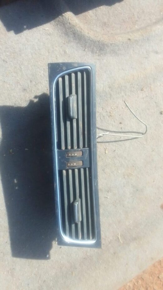 Audi A4 B8 Centre Dash Air Vent - Used Front view of a used Audi A4 B8 centre dash air vent showing vent slats and mounting frame.Front view of a use