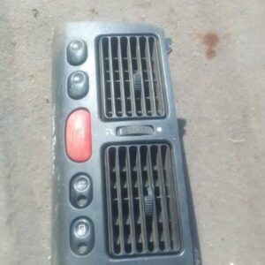 Centre dashboard air vent for Fiat Palio shown from front angle, used condition.Centre dashboard air vent for
