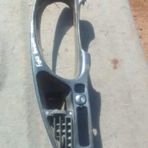 Front view of a used cluster surround for a 2006 Ford Bantam dashboard panel.Front view of a used cluster surr