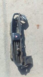 Front view of a used Kia Picanto center dash air vent showing mounting clips and vent fins.Front view of a use