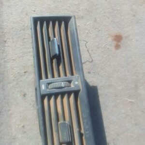 Centre dashboard air vent for Mercedes W202, shown from front angle, used condition.Centre dashboard air vent