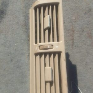 Front-facing view of a used dashboard air vent for a 1998 Mercedes W210, showing the grille detail.Front-facin