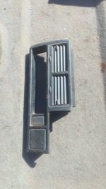 Front view of a used centre dash air vent for a 1997 Mazda 323, showing horizontal slats and mounting points.F