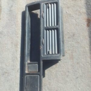 Front view of a used centre dash air vent for a 1997 Mazda 323, showing horizontal slats and mounting points.F