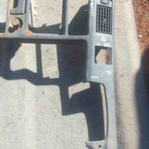 Front view of used centre dash air vent for Toyota Conquest, showing four rectangular vents in black plastic.F