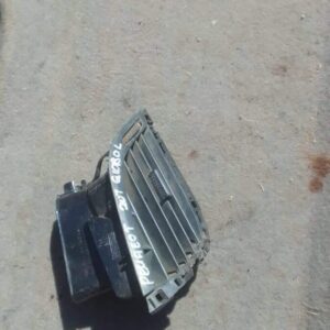 Front view of a used car dashboard air vent, black plastic with silver trim, in good condition.Front view of a