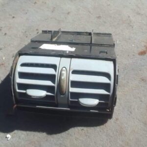 Front view of a used Mercedes W203 centre dash airvent showing black slats and mounting frame.Front view of a