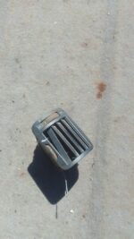 Left side dashboard air vent for Volkswagen Passat, used, shown from the front angle.Left side dashboard air v
