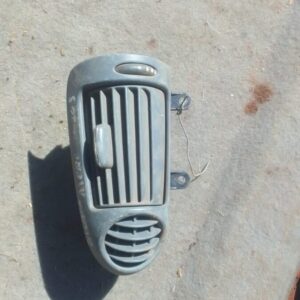 Left side dashboard air vent from Mercedes W203, shown front-facing, used condition.Left side dashboard air ve