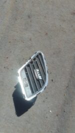 Right side dashboard air vent for Audi A4 B8, shown up close, used condition.Right side dashboard air vent for