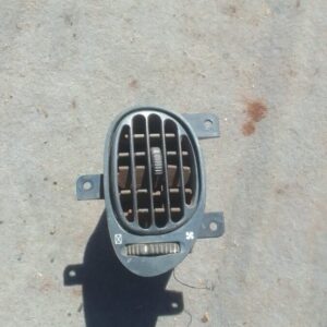 Front view of a used Hyundai Elantra dashboard air vent assembly with control knob and vent fins.Front view of