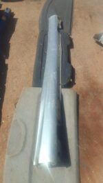 Right side skirt for Mercedes W203 C230, angled view showing used condition and mounting points.Right side ski