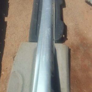 Right side skirt for Mercedes W203 C230, angled view showing used condition and mounting points.Right side ski