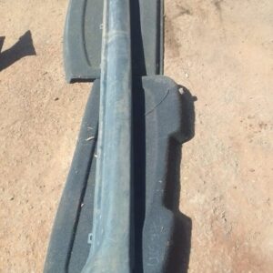 Right side skirt for Jeep Grand Cherokee, used condition, shown from side angle on a workshop floor.Right side