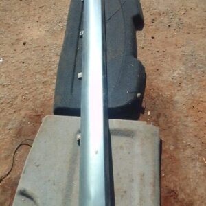 Right side skirt for Nissan Micra shown from side angle, used condition with surface wear visible.Right side s