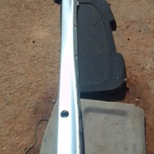 Left side skirt for BMW E36, used condition, shown from side angle on a plain background.Left side skirt for B