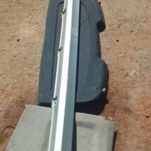 Left side skirt for Tata Indica, used condition, shown from a side angle on a plain background.Left side skirt