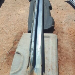 Left side skirt for Volvo S80, angled view, used condition, showing mounting points and surface details.Left s